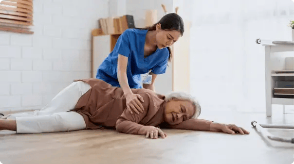 nurse helping woman on floor with purple lines